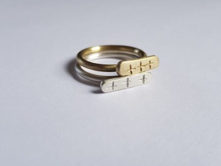 Brass and silver crisscross signet ring duo