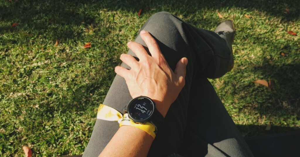 Watch and trail band on wrist in the sun