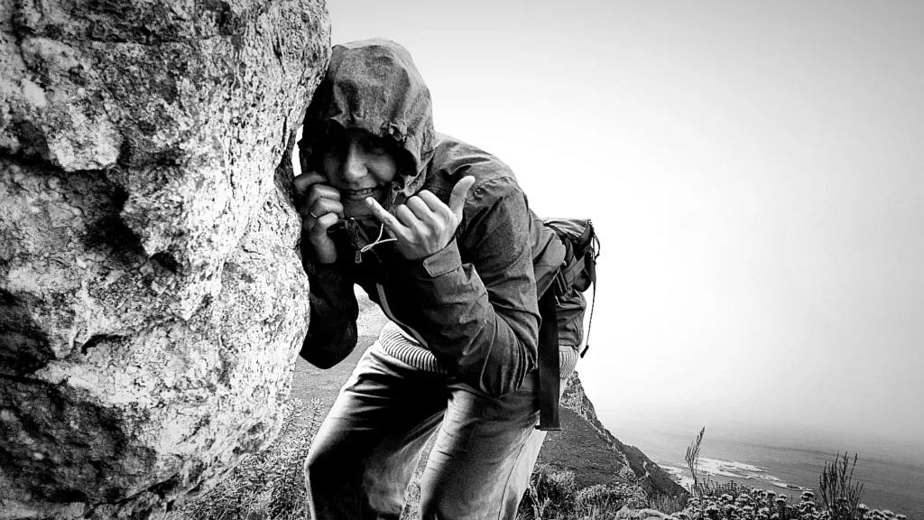 Sheltering from the rain behind a rock
