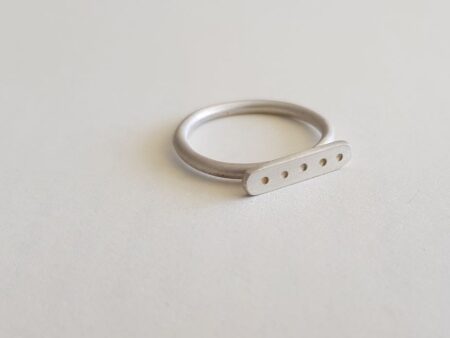 Silver round wire signet ring with letter punched dots