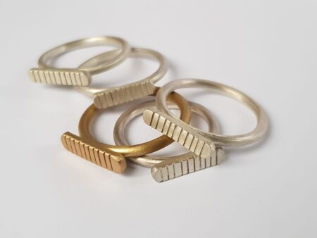Handmade brass and silver striped signet rings by Stefni