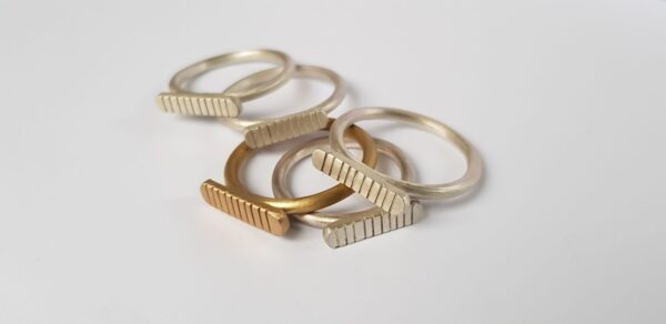 Handmade brass and silver striped signet rings by Stefni