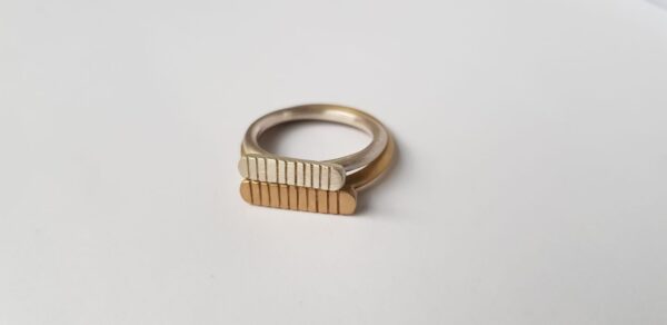 Handmade brass and silver striped signet ring duo by Stefni