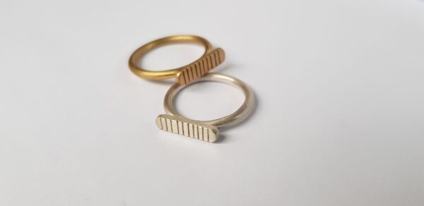 Handmade brass and silver striped signet ring duo by Stefni