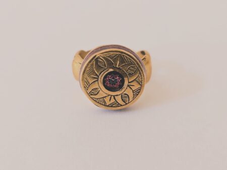 Brass round ring with glass and hand engraved detail